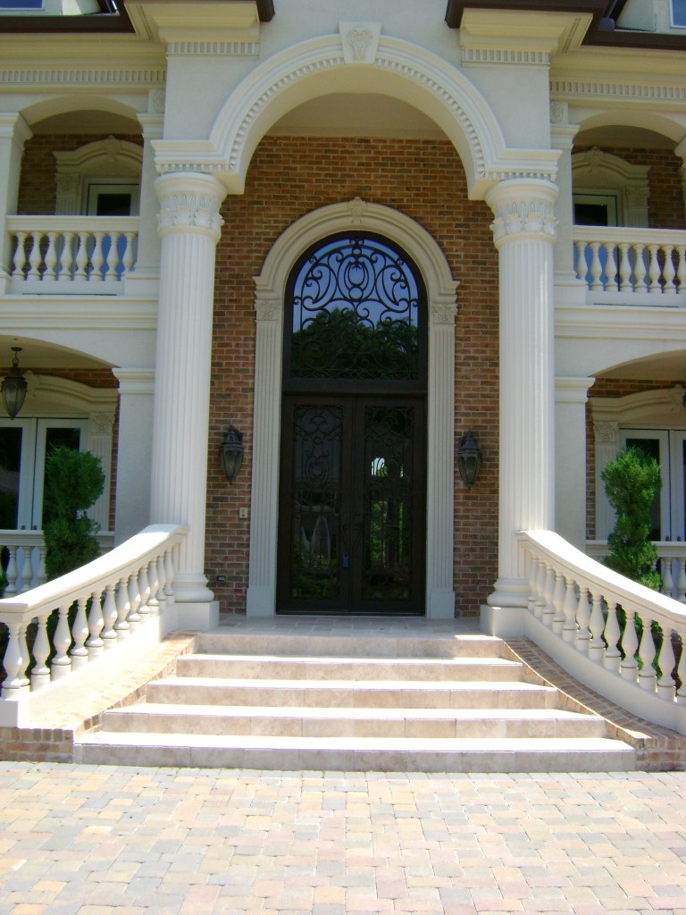 Large tall Atlanta iron door with attached arched transom