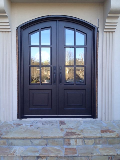 Semi arched custom Atlanta front door shown installed on stucco home