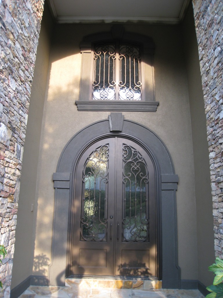 Large tall Atlanta iron door with separate arched transom