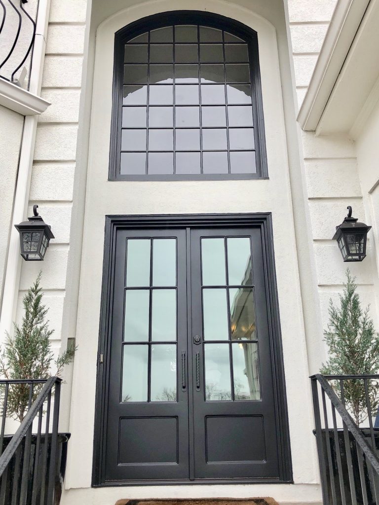 Tall square iron side by side doors with separate tall transom