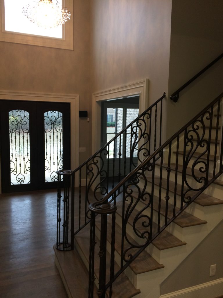 A mix between straight and swoopy spindles makes a classic look on interior stairs in Atlanta