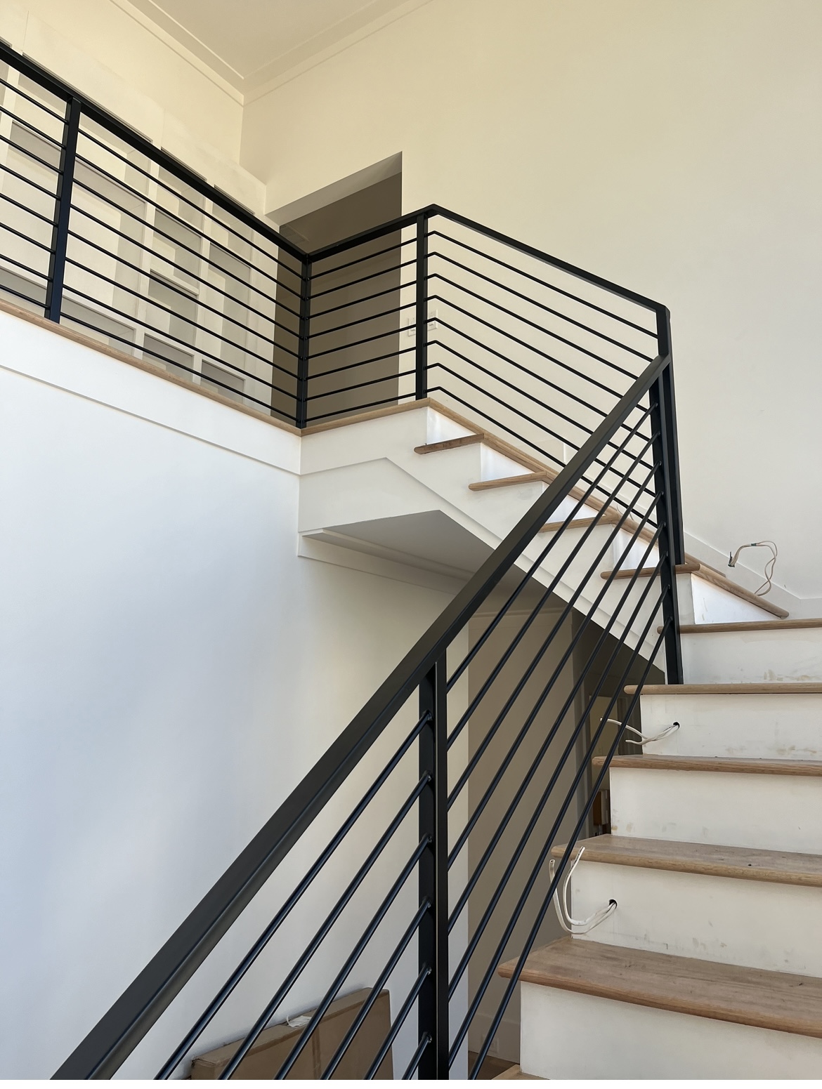 An ornate upstairs railing with gold finish shown in Atlanta